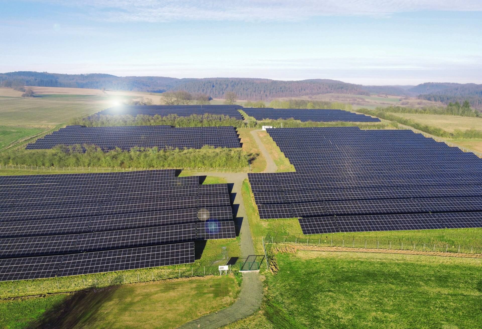Reddehausen solar farm shown above, the sun is reflected in the modules