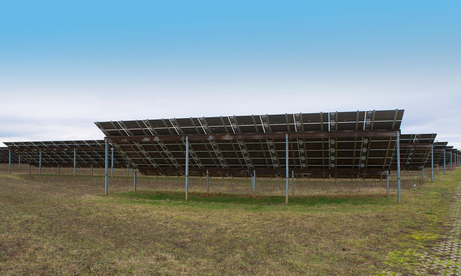 solar power plant seen from underneath the modules