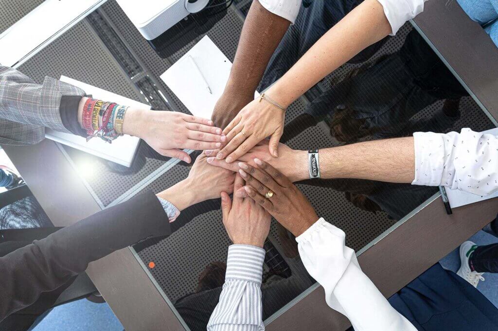 A variety of different hands together