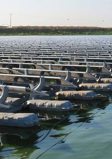 A close-up of a floating PV system on a lake