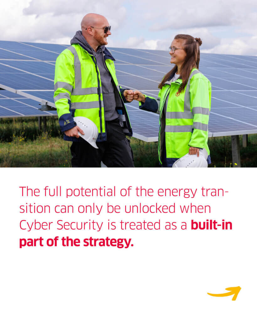 Two BELECTRIC employees in high-vis jackets stand on a solar farm and fist bump. Below, the text "The full potential of the energy transition can only be unlocked when Cyber Security is treated as a built-in part of the strategy." is written.