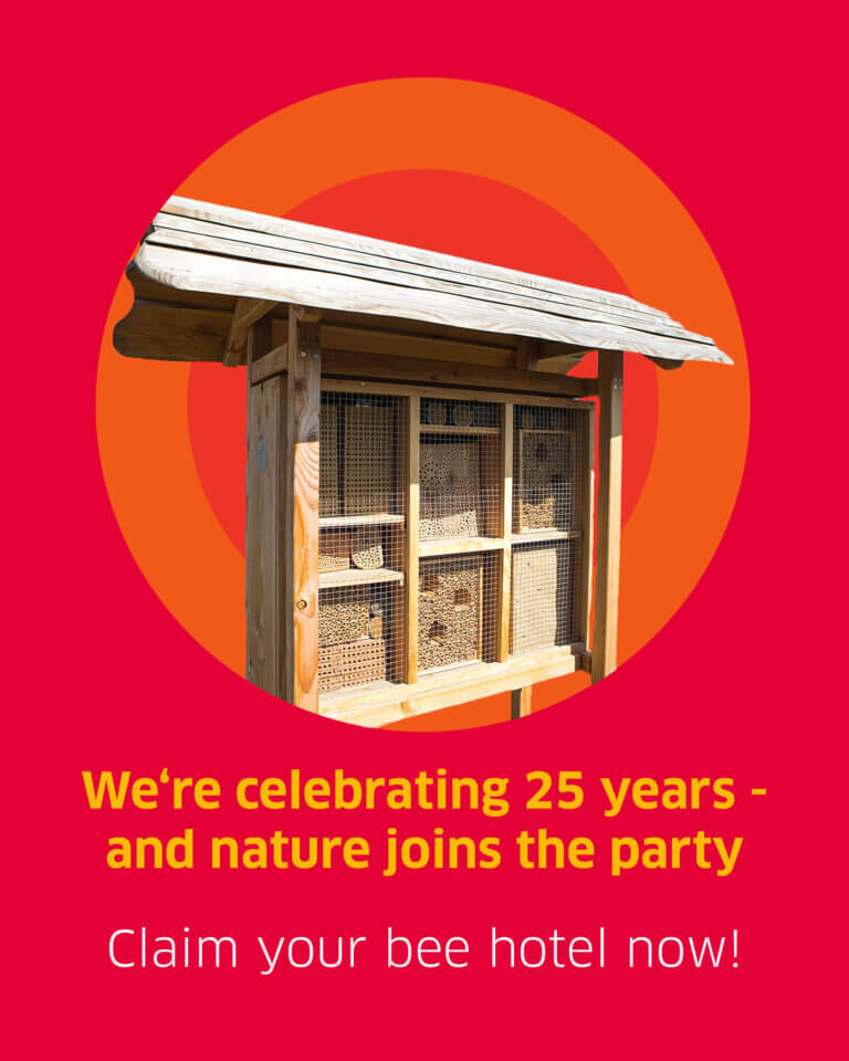 A bee hotel is shown on a red background. Below, the text reads "We're celebrating 25 years - and nature joins the party. Claim your bee hotel now!"