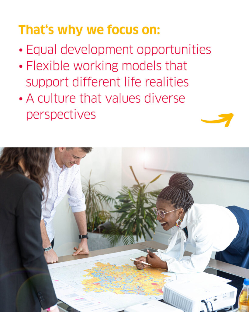 A female BELECTRIC employee leans over a map on a table and laughs. Above, the text reads "That's why we focus on: Equal development opportunities, flexible working models that support different life realities, aculture that values diverse perspectives".