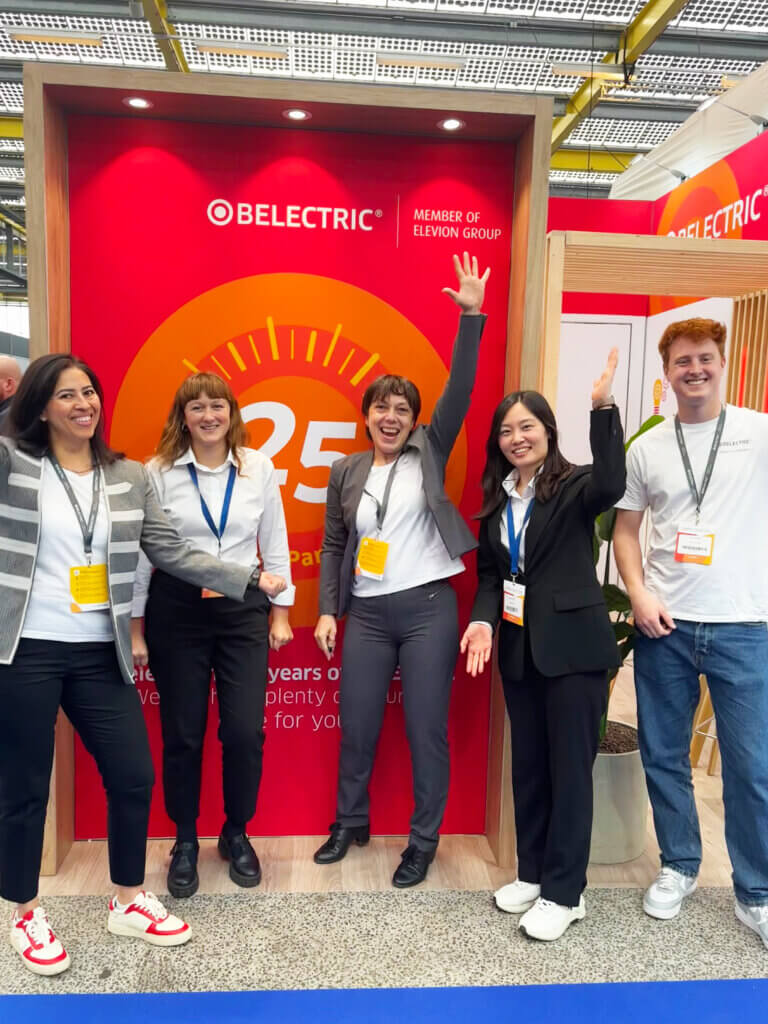 BELECTRIC team talking to visitors at the fair.