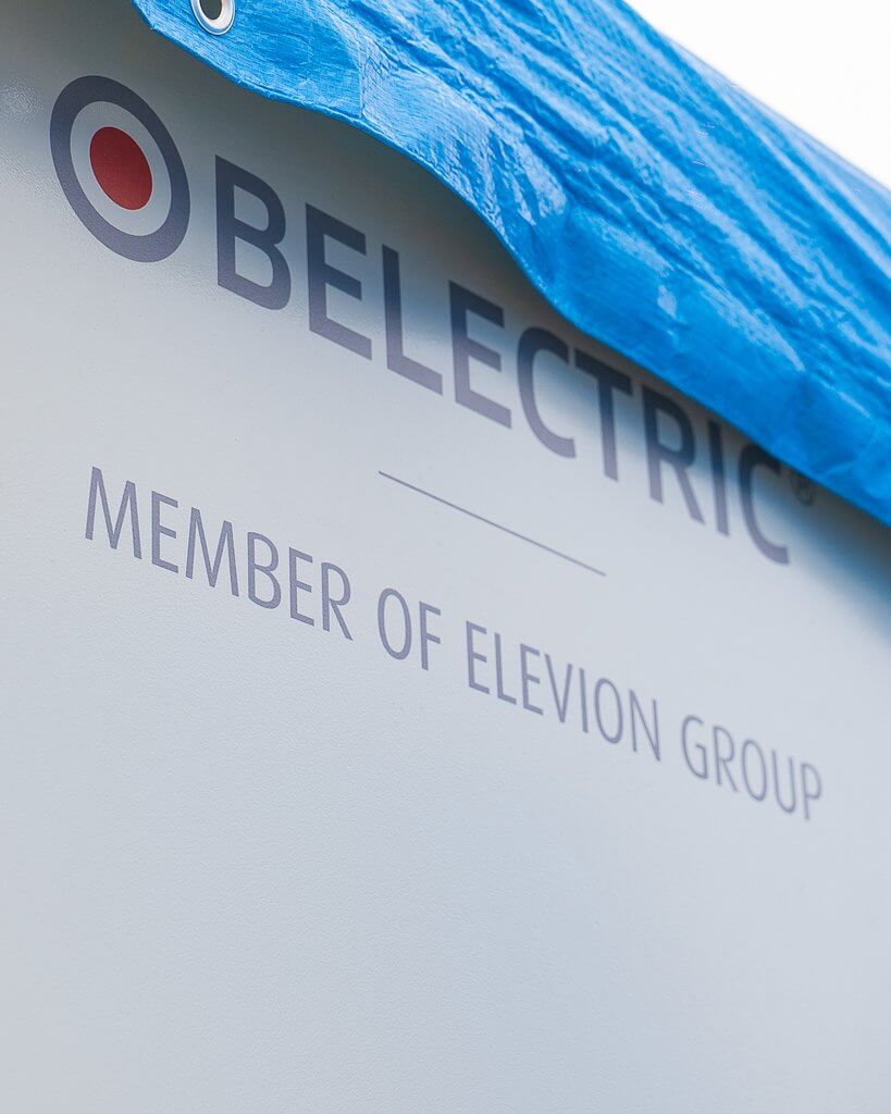 BELECTRIC branding on a battery energy storage system unit at the Cassà III hybrid solar and storage project in Cassà de la Selva, Girona, Spain.